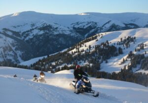 people snowmobiling in the Rockies in Leadville