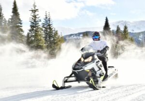 person on a snowmobile in Leadville, CO