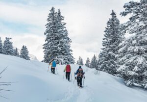 people on a colorado winter adventure in the snow snowshoeing